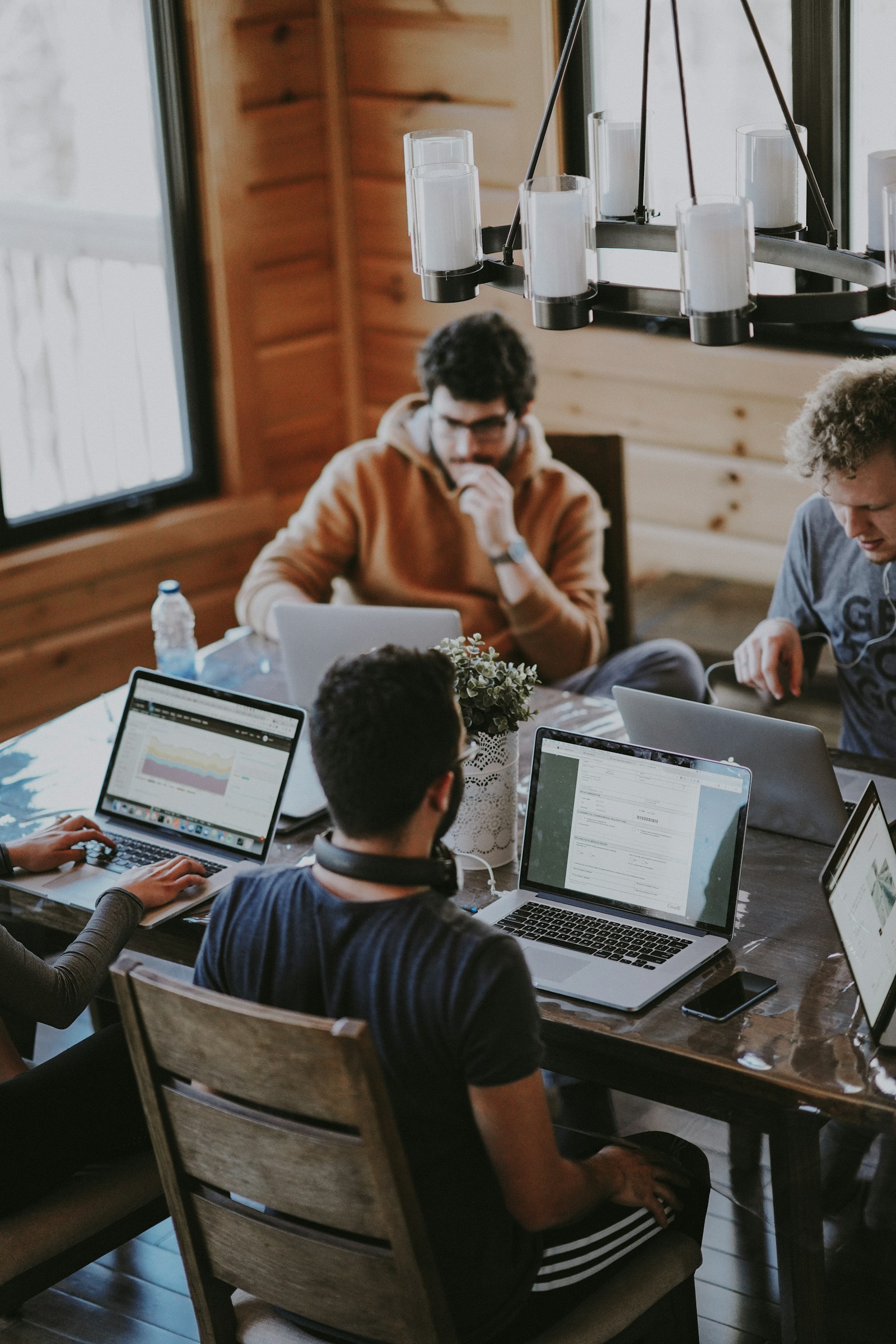 Business professionals collaborating around an office table